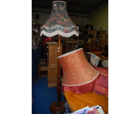A standard lamp and two shades.
