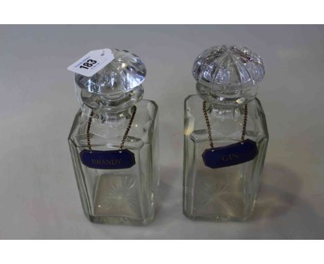 Pair spirit decanters with enamel labels.