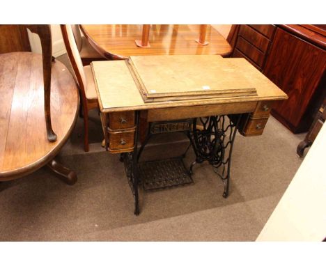 Vintage cast base Singer treadle sewing machine.