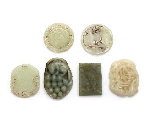A collection of six Chinese jade pendants,comprising: one circular, carved with a goose among lotus leaf, 5.3cm diameter, one