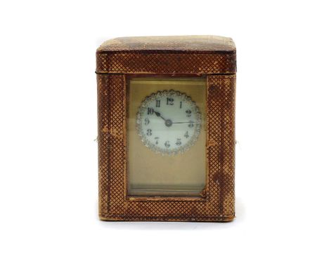 A brass cased carriage clock, circa 1890, the white enamel dial with black Roman numerals within a border of facetted clear s