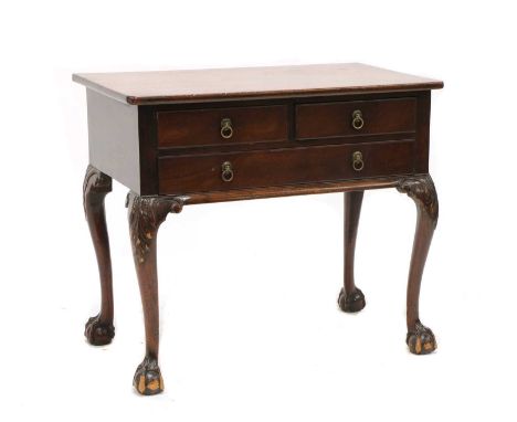 An early 18th century walnut lowboy,with three drawers on cabriole legs and ball and claw feet,82cm wide51cm deep70.5cm highC