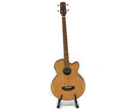 A Gear4music electro acoustic bass guitar, the hollow body with a varnished finishCondition report: Surface scratches, knocks