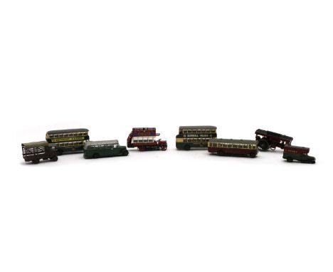A collection of kit or scratch-built metal railway layout accessories, including buses, carts, cars, traction engines, fire e