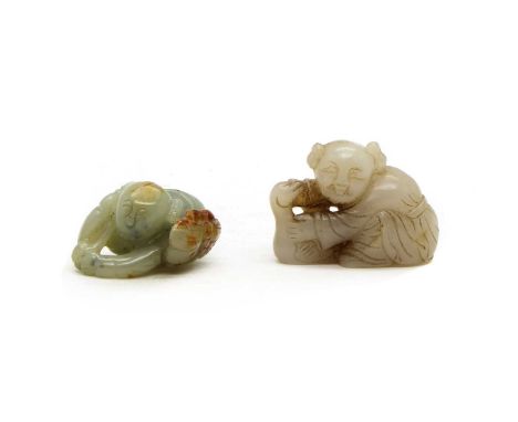 A Chinese jade carving of a boy with a goose, 5.2cm long, together with another of a boy with a butterfly to the front, 5cm l