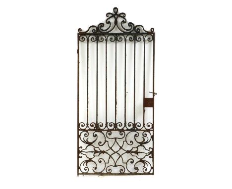 A wrought iron gate,late 19th to early 20th century, the scrolled top above straight bars and a scrolled base,110cm wide250cm