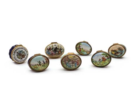 A collection of seven Bilston and Battersea enamel boxes, including examples with lids depicting a fishing scene, hunting sce