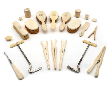 A collection of ivory dressing table items, late 19th to early 20th century comprising three handheld brushes, two hairbrushe