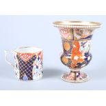 A 19th century Derby porcelain coffee can, decorated in the Imari style (handle restored) and a