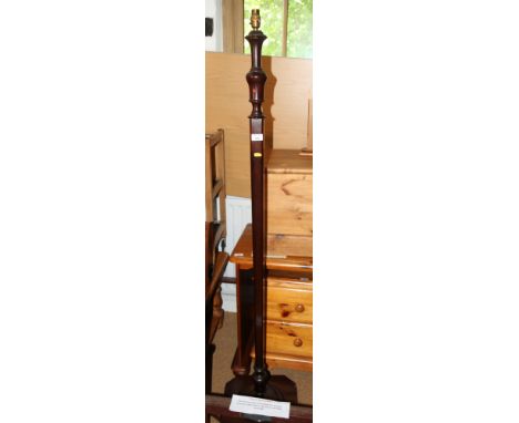 A square section stained wooden standard lamp 