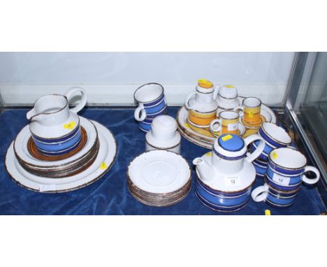 A collection of 1970s Midwinter "Stonehenge", "Sun", "Earth", and "Moon" ceramics, designed by Eve Midwinter, including "a "S