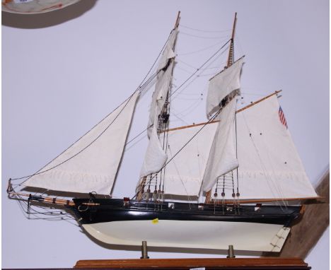 A scale wooden model of an American single decked two-masted warship, 34" long 