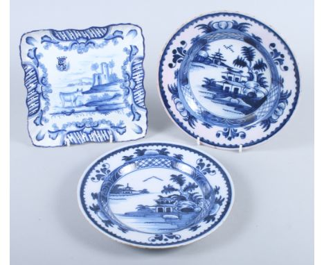 A Delft square dish, decorated cows and castle, 8" square, and a pair of Delft plates, decorated lake scenes 