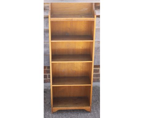 A pine six shelf open bookcase, 19" wide, and a similar oak bookcase, fitted five shelves, 18" wide 