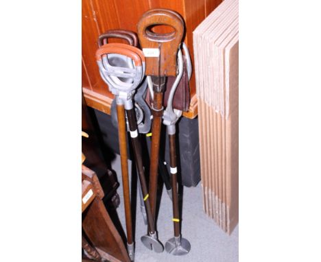 A modern sabre, a Harrods shooting stick and five other shooting sticks 