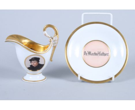 A late 19th century Berlin porcelain cream jug and stand, decorated portrait of Martin Luther, 4 1/2" high overall 