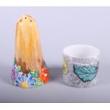 A Clarice Cliff "My Garden" sugar caster (tip restored), 5 1/2" high, and a Fornasetti cache pot,
