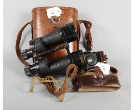 A pair of binoculars, in fitted leather case, together with a camera 