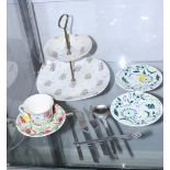 A Midwinter "Capri" cake stand, two Midwinter "Moonflare" green floral saucers, designed by Jessie
