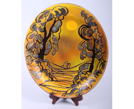 A Poole Aegean pottery oval charger, decorated with Corfe Castle at sunrise, 15 1/2" wide 
