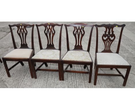 A set of three Chippendale design mahogany dining chairs with pierced splats and drop-in seats, on square supports, a similar