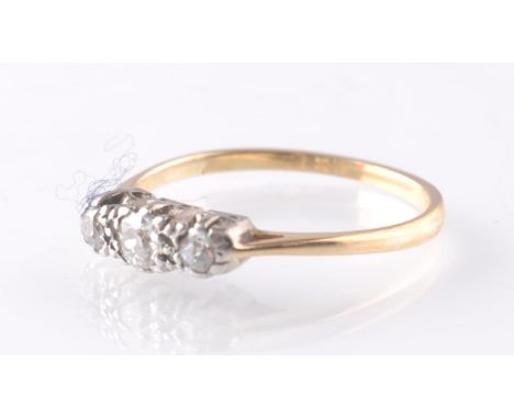 An 18ct gold 3 stone diamond ring. Gross weight 1.9g having old cut diamonds approx 0.15ct. Size M.