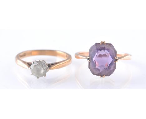 Two vintage 9ct gold rings. One ring being set with a mixed cut amethyst the other a round cut white stone. Both marked 9ct. 