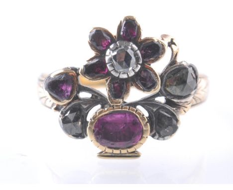 An antique Georgian 18th / 19th century ruby and diamond giardinetto ring set within cylinder box. Size N.5 / Weight 3.07g