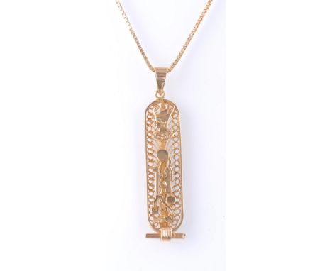 An 18ct gold Egyptian pendant necklace. The necklace strung with a pendant having an Egyptian cartouche on a fine box chain. 