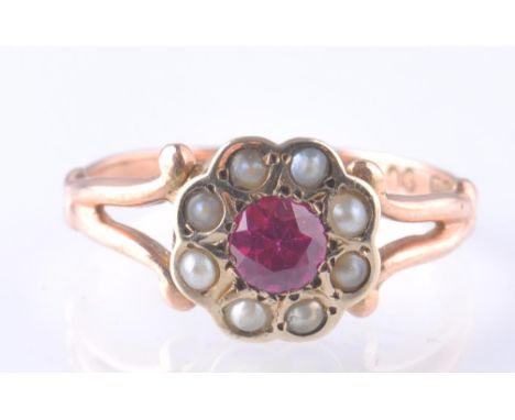 A Victorian 9ct gold seed pearl and synthetic ruby cluster ring.&nbsp; The central ruby approx 4mm diameter surrounded by see