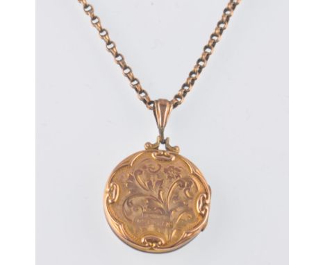 A 9ct gold back and front locket with scroll and shield cartouche strung on a rolled 9ct gold book chain. With barrel clip cl