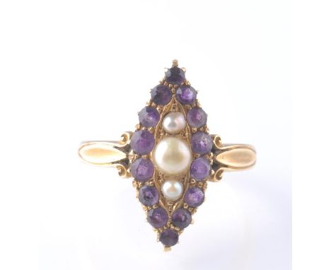 A Victorian 19th century 18ct gold amethyst and half pearl navette ring. The central 3 pearls within a halo of amethyst round