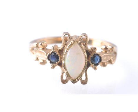 A 9ct gold London hallmarked opal and sapphire ring. Marquise cut opal flanked by round cut sapphires. Sponsors Mark AI. Tota