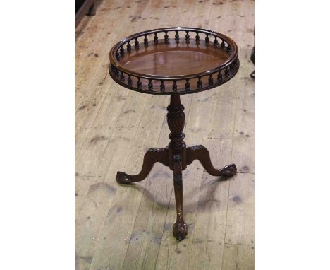 Circular mahogany tripod table with spindled gallery, 46cm diameter.
