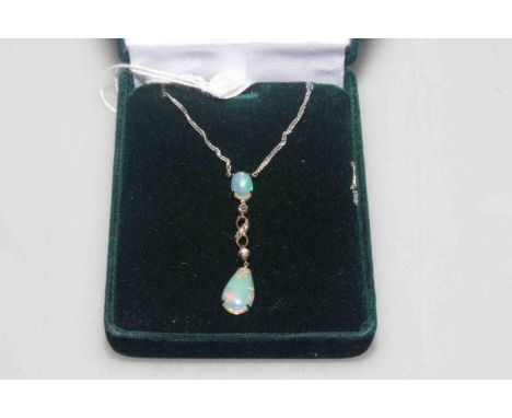 Opal and diamond pendant on a platinum chain