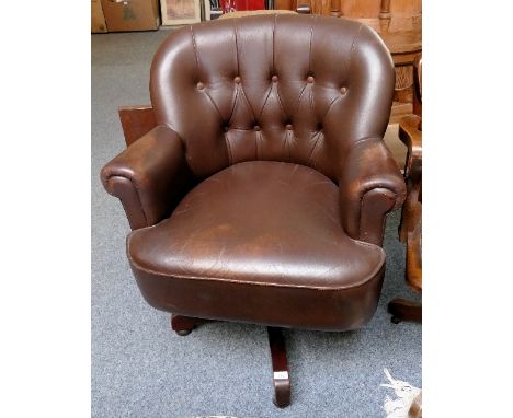 A button back swivel armchair