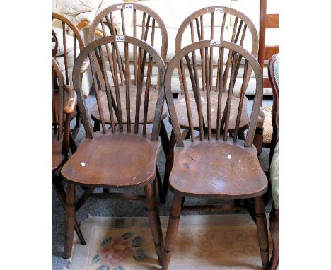 A set of 4 stick back kitchen chairs