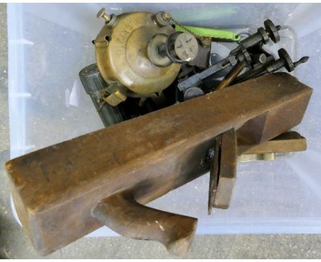 A box of tools, including planes, primus stove etc