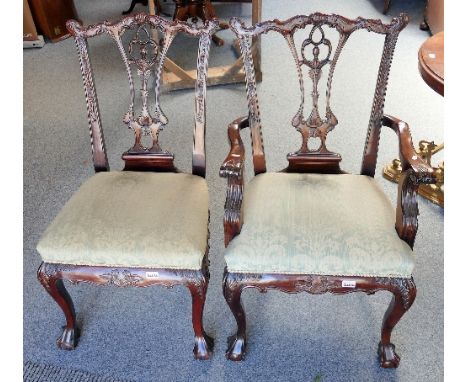 A set of 6 single and 2 carving Chippendale style carved mahogany dining chairs, with ball and claw feet