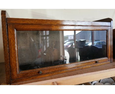 An oak single wernicker style glazed book shelf