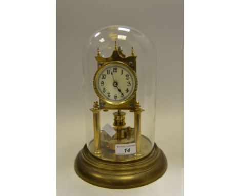 A gilt Anniversary clock, glass dome