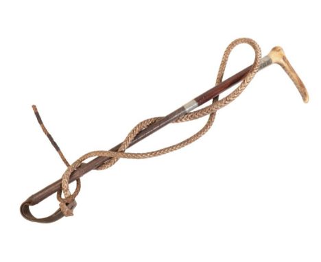 SWAINE & ADNEY: A GENTLEMAN'S HUNTING CROP with antler handle, double silver collars and leather plaited shaft, leather grip 