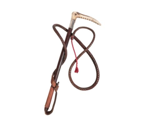 SWAINE & ADNEY, LONDON: A GENTLEMAN'S HUNTING CROP with antler handle, silver collar, plaited leather shaft and plaited leath