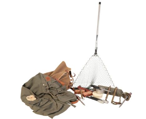 A CANVAS FISHING BAG containing fishing priests, brass scales, a hunting knife, a Hardy fishing vest and a landing net