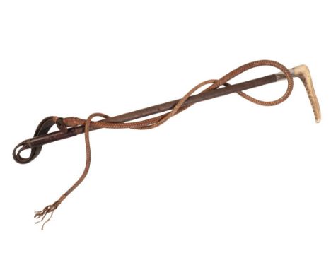 A LADY'S HUNTING CROP with an antler handle, a silver collar, plaited shaft and leather plaited thong, 60cm longProvenance: A