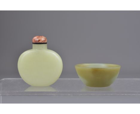 A Chinese jade snuff bottle together with a small jade bowl. 5 cm and 6 cm.