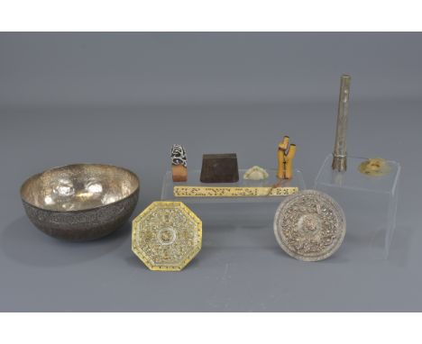 Ten items of Asian artefacts including four silver-coloured metal items, three seals, two agate items and one ivory fan handl