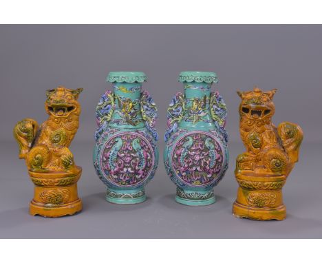 A pair of 19th century turquoise glazed porcelain vases with dragon handles bearing a six character mark of Qianlong. 23 cm t