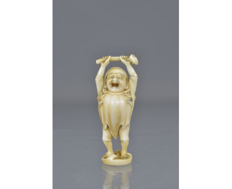 A signed Japanese Meiji period carved ivory netsuke of Daruma. 5cm tall 