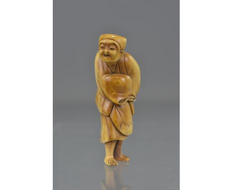 A Japanese Meiji period carved ivory netsuke of a man. 6.5cm tall 